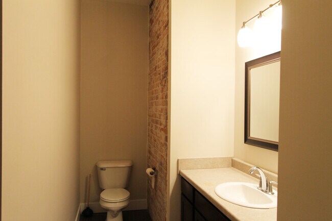 Building Photo - Midtown Renovated Duplex - Hardwood Floors, Exposed Brick