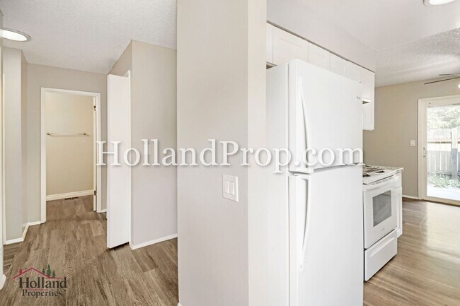 Building Photo - Charming 3-Bedroom Duplex with Fenced Yard, Fireplace & Garage Near Hwy 26!