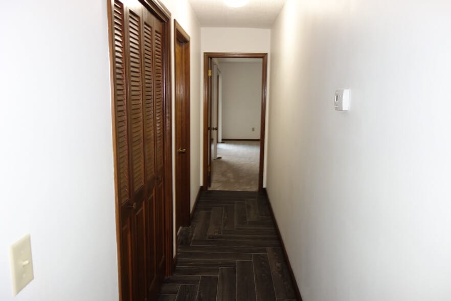 hallway leading to Master bedroom with linen closet on left - 3324 E 73rd St