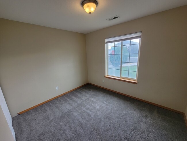 Building Photo - Comfortable 4-Bedroom Home with Fenced Bac...