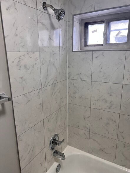Tiled Shower in Bathroom - Apt. 2 - 703 E 10th St
