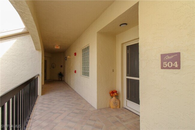 Building Photo - 7024 Pelican Bay Blvd