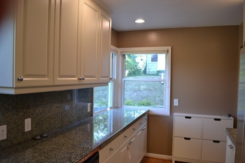 The kitchen features ample storage and granite tile. - 9121 SW 35th Ave