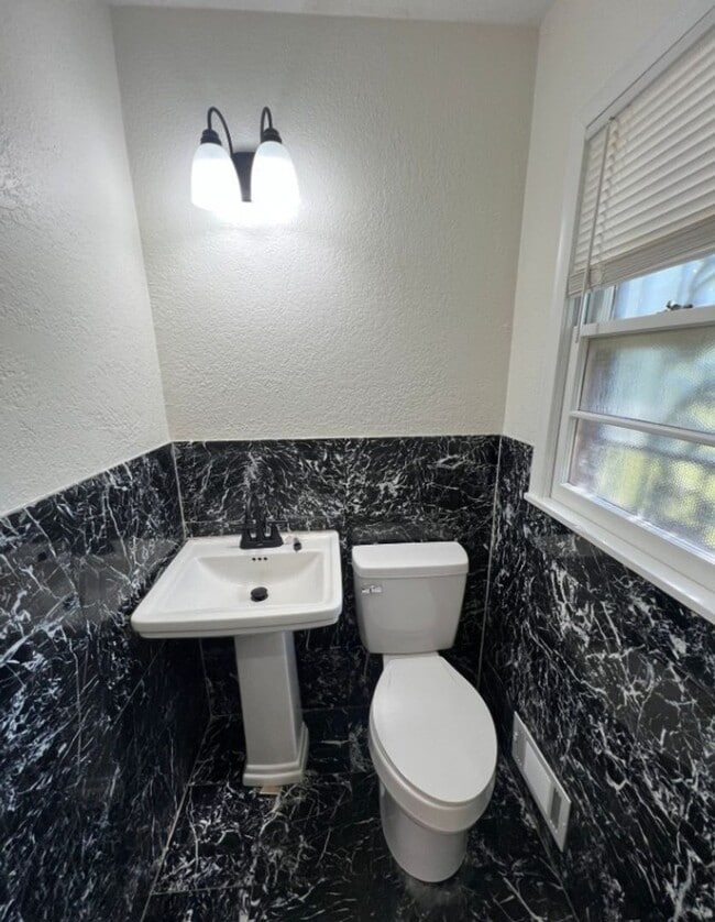 Building Photo - Spacious 4-Bedroom Home with Finished Base...
