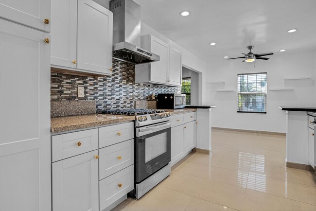 Building Photo - Stunning Remodeled Corner-Lot Home – An En...