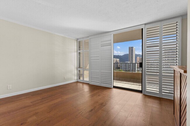 Building Photo - Wake Up to Stunning Mountain & Ala Wai Canal Views in the Heart of Waikiki