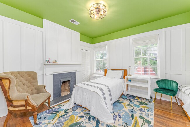 Bedroom with decorative fireplace - 108 W Henry St