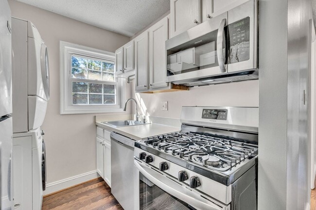 Building Photo - Utilities Included! Updated 2-Bedroom Condo Just Steps from Huntington Metro