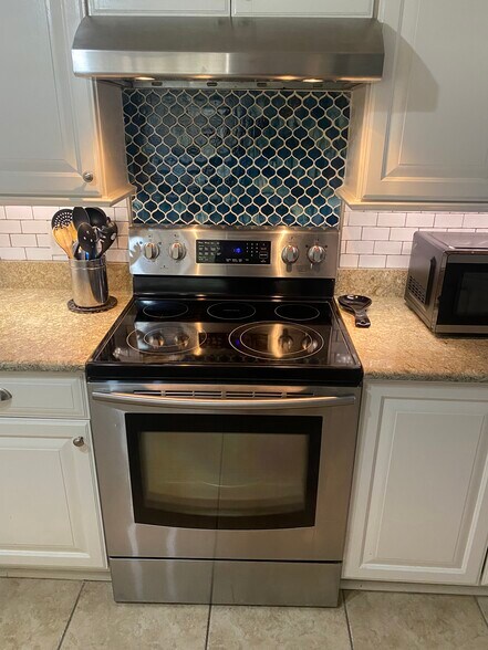 Kitchen stove/oven, microwave. - 648 Glenview Dr