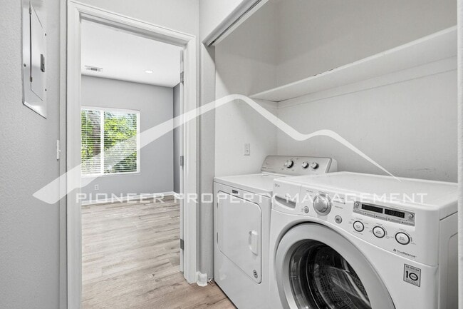 Building Photo - Spacious Condo with Central AC, Covered Parking, and Washer/Dryer