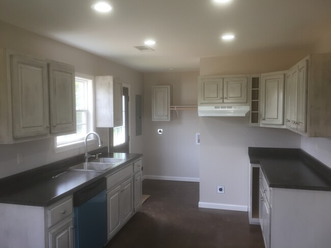 Kitchen with lights on - 81 Villa Lane