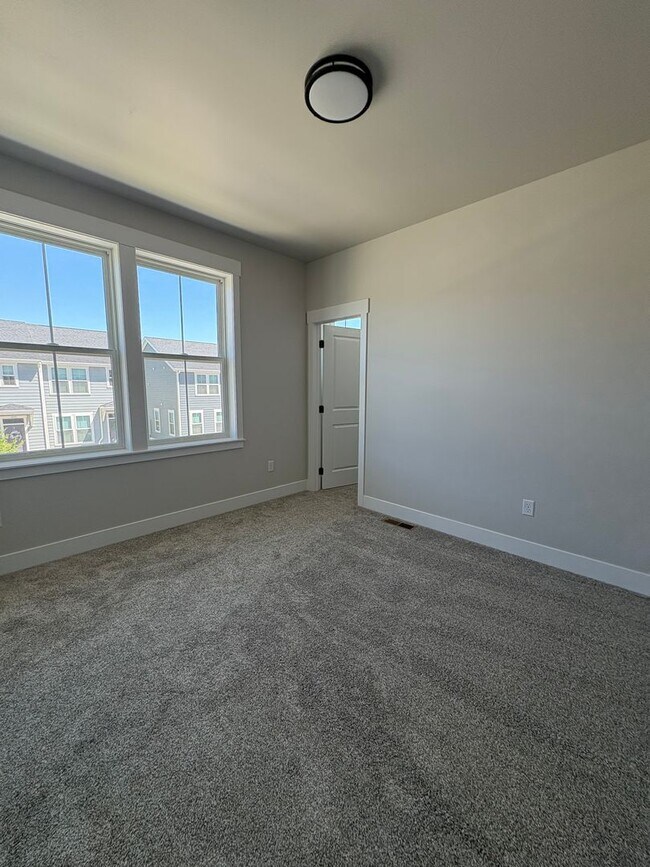 Building Photo - New construction townhome – two bed two bath with garage