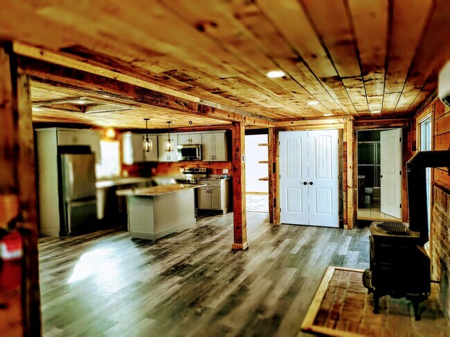 Spacious, well-insulated living space with working propane fireplace. - 94 Cross Rd