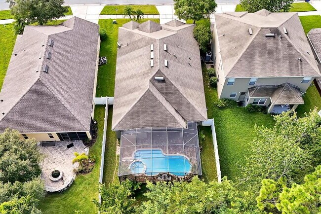 Building Photo - "Stunning 3BR Orlando Home with Private Screened Pool, Spa & Spacious Living Areas"