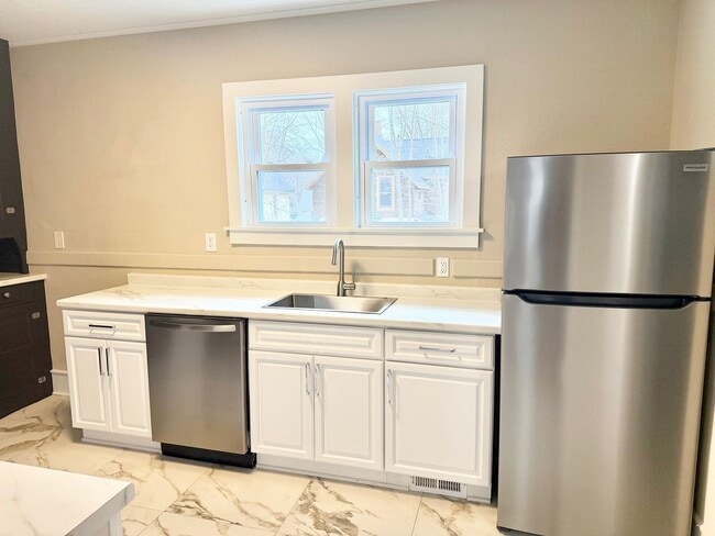 Building Photo - Updated 3-Bedroom Home on Tree-Lined Street with Off-Street Parking