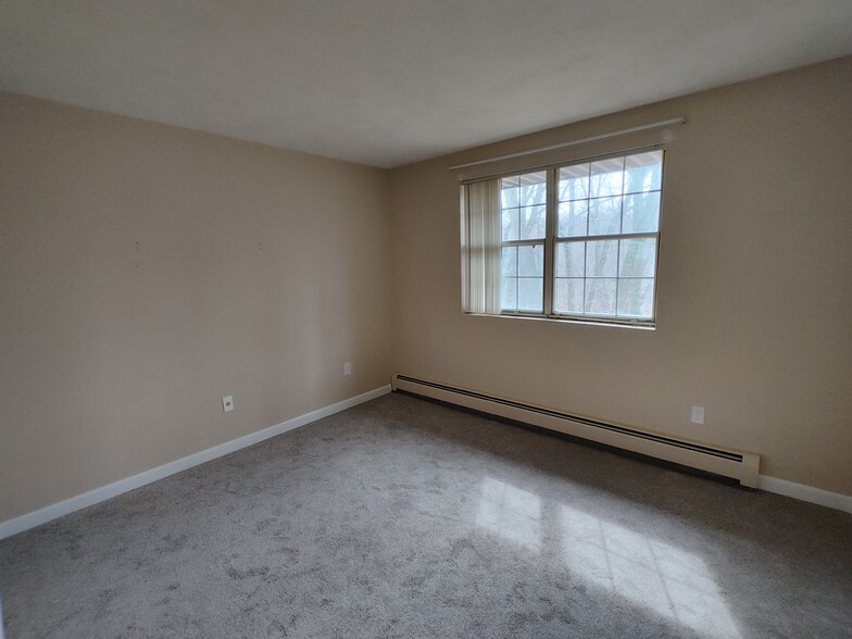 Guest Bedroom with new baseboard, carpet, and outlets - 9 Kenmar Dr