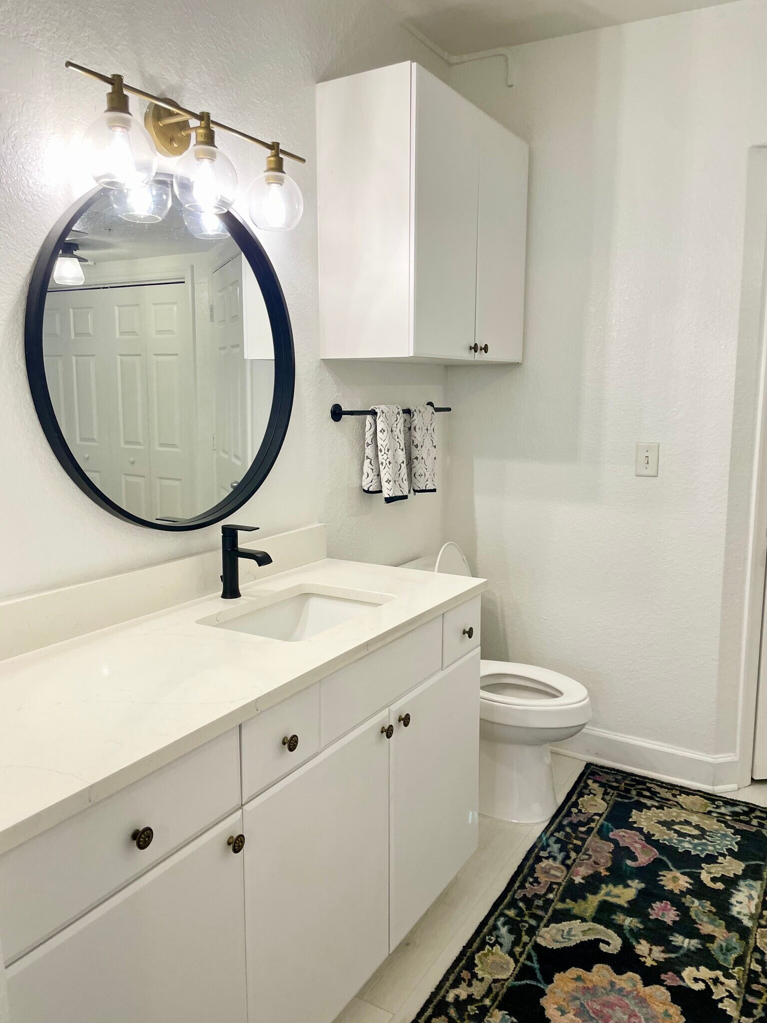 New countertops, Moen faucet and shower fixtures, mirror, lighting, and toilet - 304 E South St