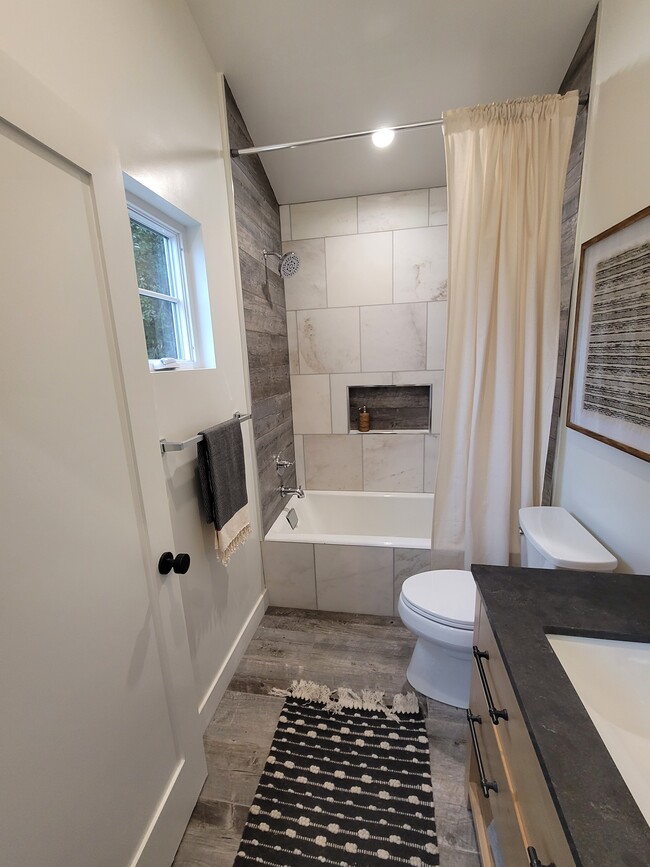 Primary bath has a deep soaking tub/shower combo - 3649 Cazador Dr