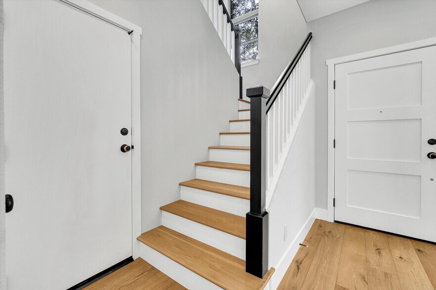 Door by the stairs leads to attached 3-car garage - 759 Border Ave