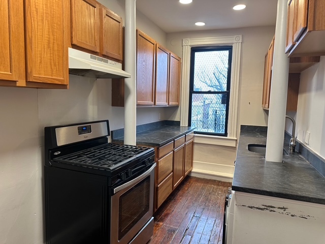 Kitchen has granite and stainless - 2928 St Paul St