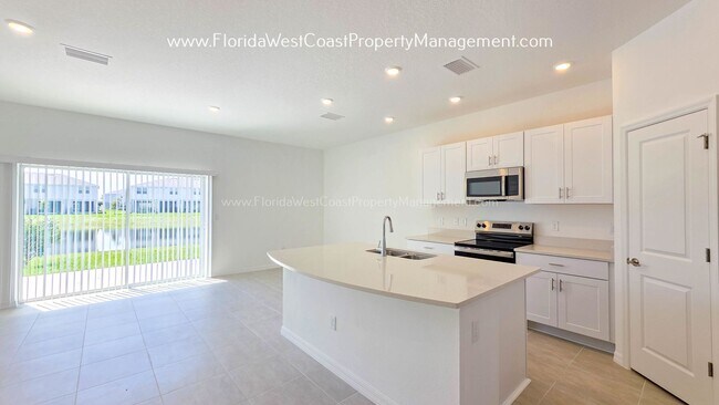 Building Photo - OUTSTANDING BRAND NEW TOWNHOME MOVE IN READY! AZARIO TOWNHOMES LWR !