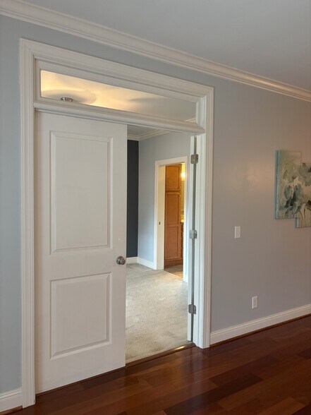 solid wooden doors into primary bedroom - 301 Criddle St