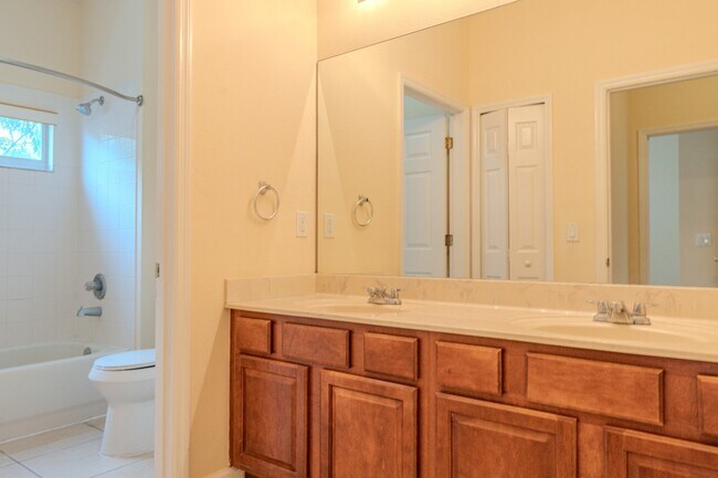 Building Photo - Spacious 5BR Home in Falcon Trace | 3-Car Garage | Screened Patio | Resort-Style Amenities Rent: ...