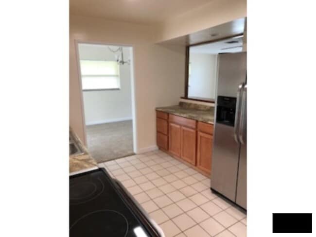 Building Photo - Large Corner Lot, Fenced in Yard, New Flooring, Fresh Paint, Lawn Care Included!