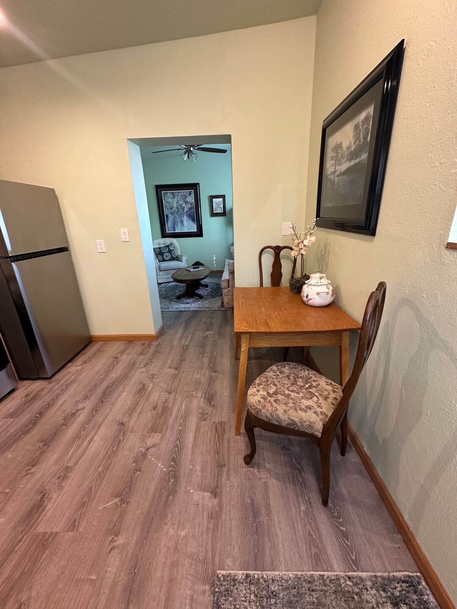Dining room table and view into living room - 400 Main St
