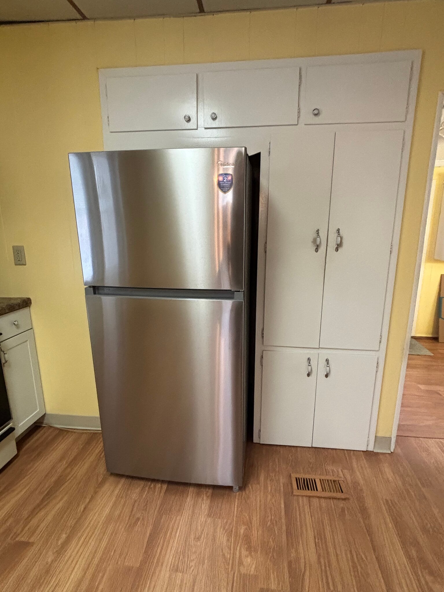 Kitchen with new fridge & microwave - 203 E McKinley St