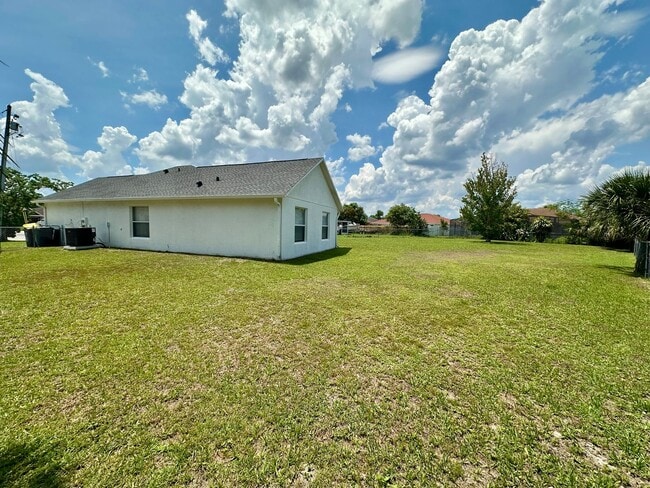 Building Photo - Three-Bedroom House with a Fenced Yard!