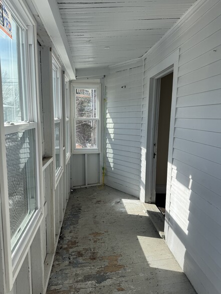 Unit 2 enclosed private porch - 128 Pleasant St