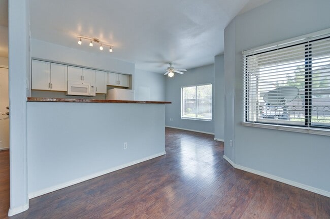 Building Photo - NW!! Gated!!! Clubhouse!!!Community Pool!!! 1st Floor Condo!!! Wood like floors!! No Carpet!!