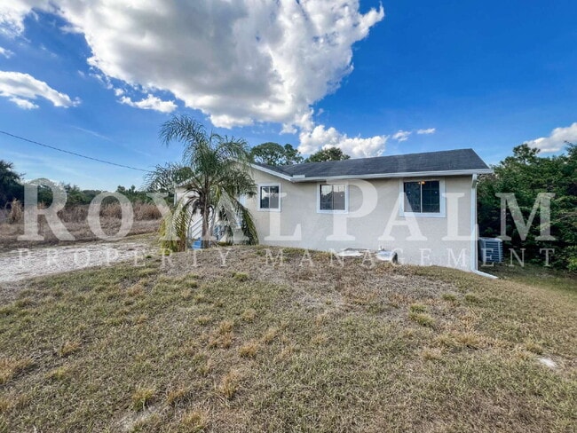 Building Photo - 4 Bedrooms, 2 Bathrooms & a Huge Backyard — Spacious Lehigh Acres Home with Pet-Friendly Living o...
