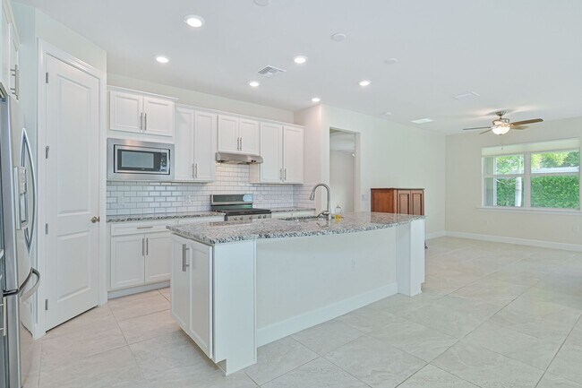 Building Photo - NOW AVAILABLE - 2/2 Plus Den Single Family Home in the Heart of Estero!