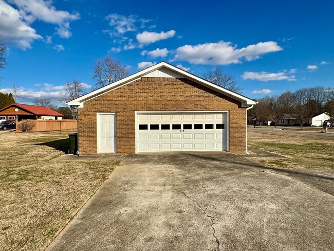 Building Photo - Well maintained brick home on a nice corne...