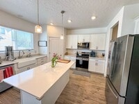 Building Photo - Modern 4 Bed 3.5 Bath Home in Syracuse | Bonus Room + Fenced Yard + 86” TV Included