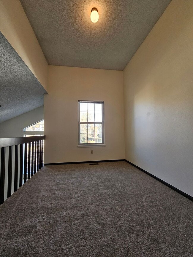 Building Photo - End Unit Condo with Private Patio