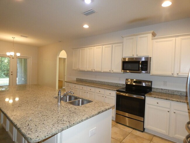 Building Photo - Spacious 5-Bedroom Home - Heart of Pace
