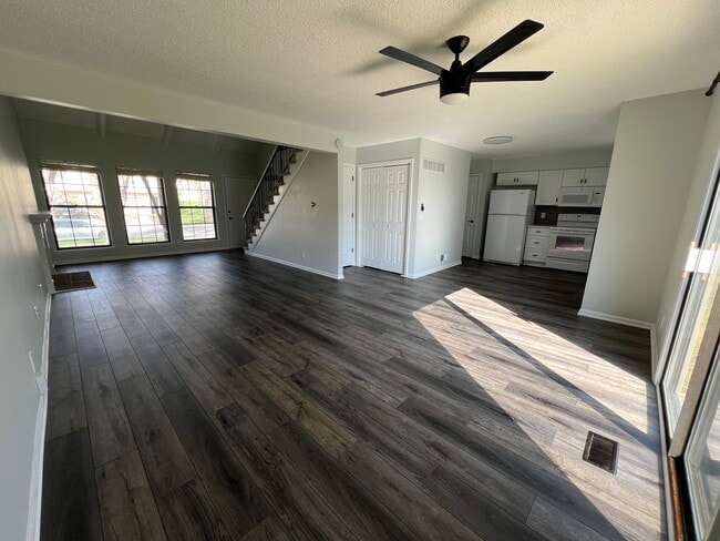 Living room/dining room/kitchen/back door - 14103 W 88th Terrace