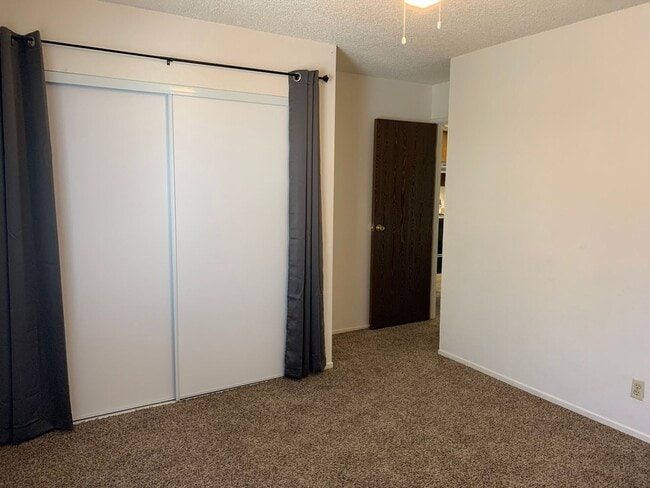 Building Photo - ENJOY THE POOL THIS SUMMER IN THIS GATED C...
