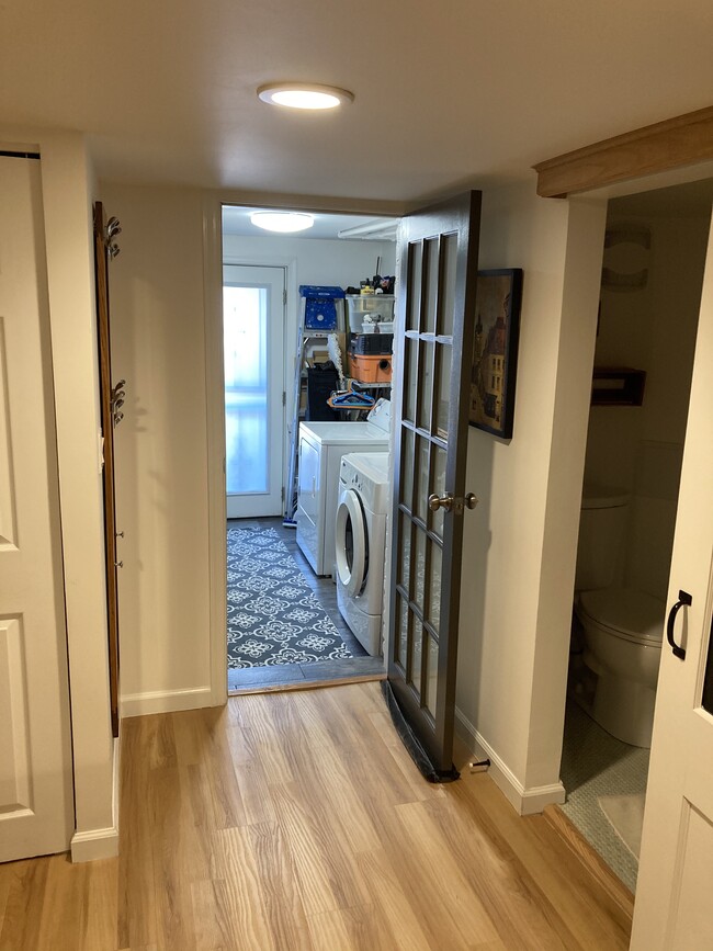 Laundry room, Full size Washer/Dryer, storage & utility area, back door to patio (lower level). - 526 24th St NE