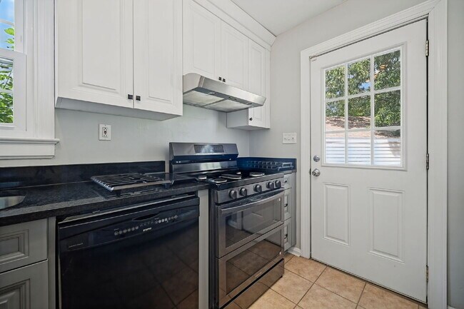 Building Photo - RARE FIND-4 BEDROOMS, 2 BATHROOMS, FENCED BACK YARD and GARAGE-PETS!!