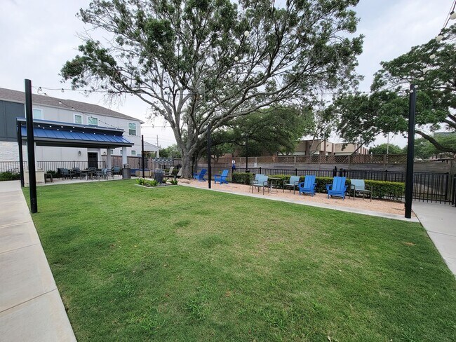 Building Photo - A true gem on a quiet corner lot, this spacious and sun-filled home is tucked away from street no...