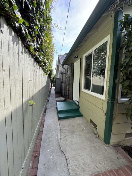 Side of home showing back door exit from kitchen - 7635 1/2 Lexington Ave