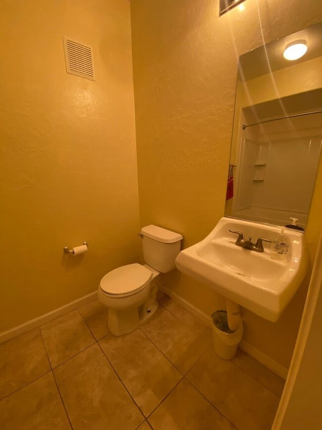 Building Photo - First Floor Unit with 2 Car Garage with Di...