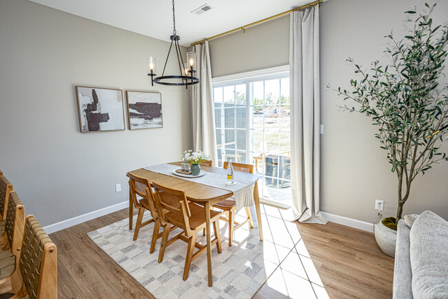 Well-lit dining area leading to back yard and patio - 110 Sierra Cir