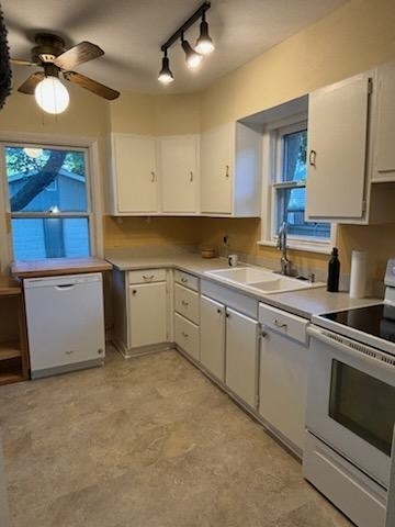 kitchen with dishwasher and double sink - 921 Clarence Ct