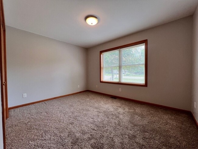 Building Photo - Spacious 3BR Duplex with Finished Basement & 2-Car Garage in Otsego