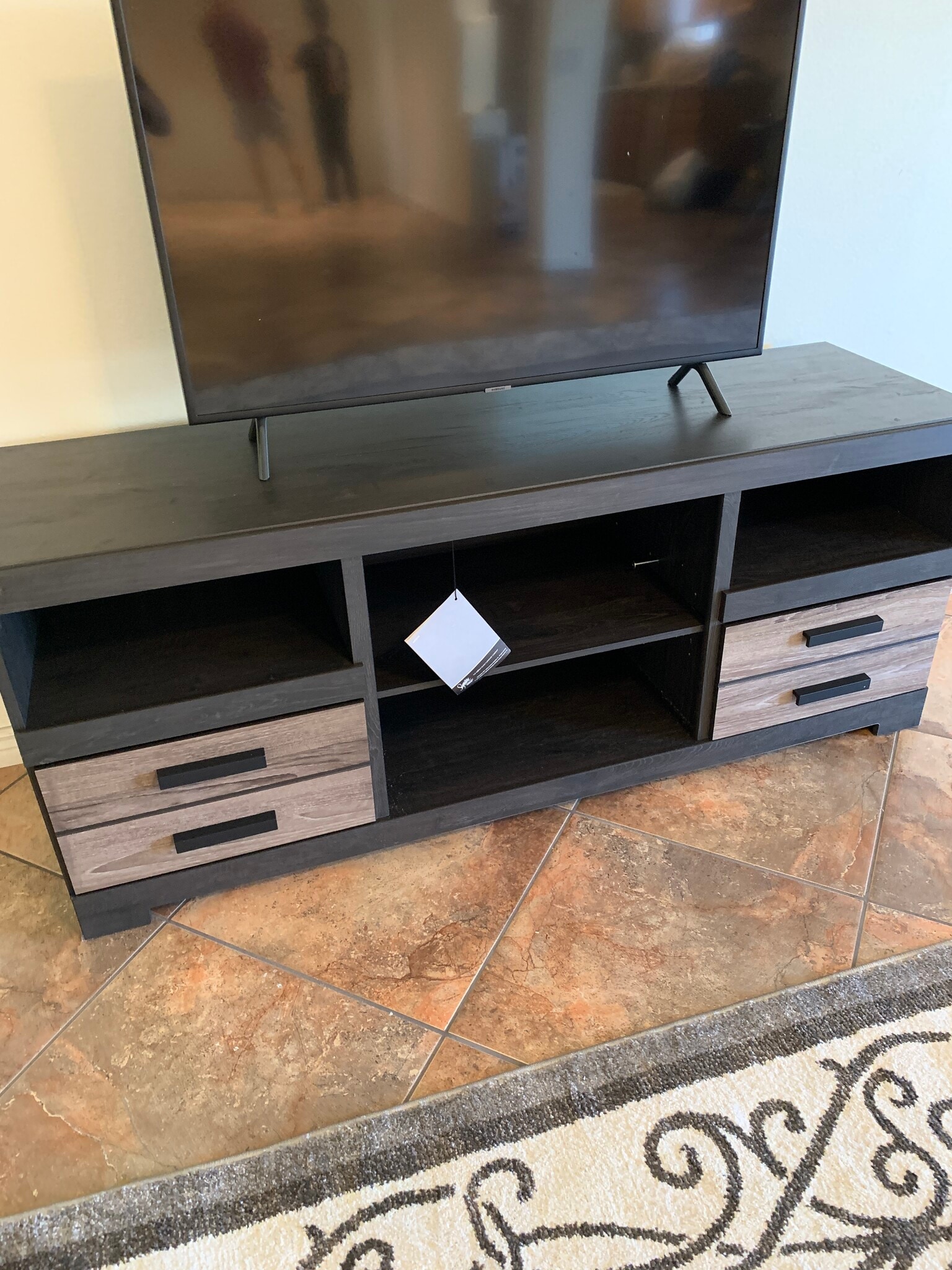 TV Stand included with TV - 1207 E Loyola Dr